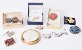 A large quantity of costume jewellery to include paste stone set brooches, gem set, etc, four