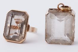 A 14ct cocktail ring set with smokey quartz? and a matching 14ct gold pendant set smokey quartz?,