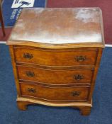 A small walnut three drawers chest, height 66cm, width 53cm.