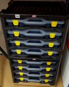 Tayg plastic tool racking with eight removable cases with variety of hand tools including