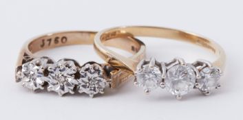 Two 9ct yellow gold three stone rings, one set with small round diamonds in an illusion setting, 3.