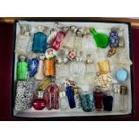 A collection of Victorian and later assorted scent bottles including silver, coloured glass,