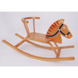 A small child's modern Rocking horse.