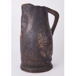 A 17/18th century black leather jug inscribed 'William Sherwin', with crest coat of arms,