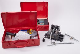 Model making vice and two red steel cases one with Bosch jigsaw with European plug and other