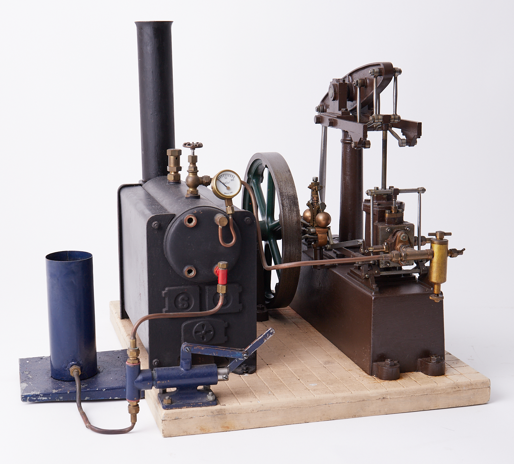 A Stuart steam engine with boiler and manual feed pump, 13" high with 12" base.