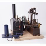 A Stuart steam engine with boiler and manual feed pump, 13" high with 12" base.