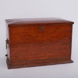 A large oak travel writing box fitted with compartments, pigeon holes and writing slope, width 42cm,