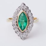 An 18ct yellow & white gold marquise shaped ring set with a central marquise shaped emerald, approx.