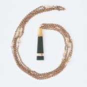 An antique 15ct yellow gold pendant set with an elongated triangular shaped dark