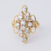 An 18ct yellow gold cocktail style cluster ring set with approx. 1.25 carats total weight of round