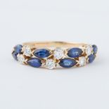 An 18ct yellow gold double row ring set with marquise cut sapphires, approx. total sapphire weight