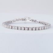 A white gold line bracelet set with forty-four round brilliant cut diamonds, total diamond weight
