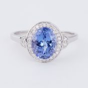A platinum modern style cluster ring set with an oval 2.69 carat tanzanite, AAA grade,