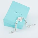 Tiffany, a curb link bracelet with a Return to Tiffany silver heart, length 18.5cm, 25.0gm.