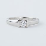 A platinum ring with a tension set 0.20 carat round brilliant cut diamond, 5.09gm, size H 1/2 to I.