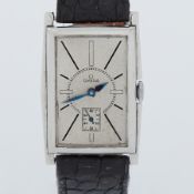 Omega, a stainless steel rectangular faced Omega wristwatch, glass missing, blue metallic hands,