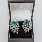 A pair of impressive 18ct white gold cocktail style earrings each set with a central square cut