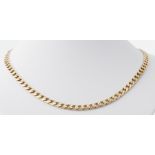 A 9ct yellow gold 20" flat curb chain, 31.44gm.
