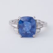 An impressive platinum ring set with a central 7.99 carat cushion cut natural Sri Lankan sapphire,
