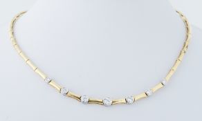 An 18ct yellow & white gold 'bamboo' link necklace set with seven round brilliant cut diamonds,