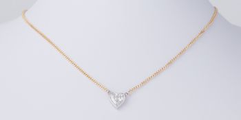 An 18ct yellow & white gold necklace set with a heart shaped diamond, approx. 1.60 carats and
