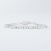 An 18ct white gold line bracelet set with approx. 6.20 carats of round brilliant cut diamonds,