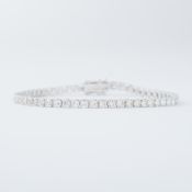 An 18ct white gold line bracelet set with approx. 6.20 carats of round brilliant cut diamonds,
