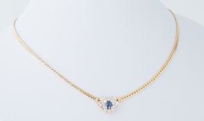 An 18ct yellow gold necklace with a flat snake style chain and set central with an oval cut