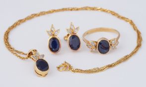 A suite of jewellery to include an 18ct yellow gold ring set with an oval cut sapphire, approx. 0.90