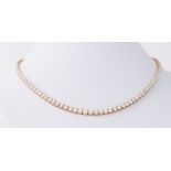 An impressive 18ct yellow gold necklace set with 12.78 carats of graduated round brilliant cut