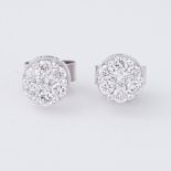 A pair of 9ct white gold diamond flower design studs set with approx. 0.42 carats total weight of