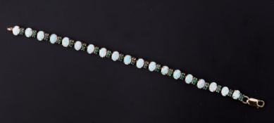 A 9ct yellow gold bracelet set with nineteen oval cabochon cut white opals, the opals measure