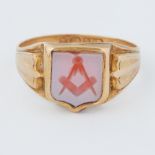 An 18ct yellow gold carved stone Masonic ring, 5.4gm, size S 1/2.