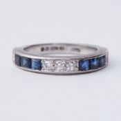 An 18ct white gold half eternity style ring set with six square cut sapphires, total