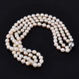 A double row of cultured pearls the inner strand approx. 16" and the outer strand 18", strung to a