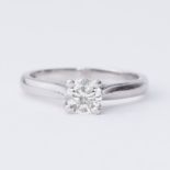 A platinum solitaire ring set with a round brilliant cut diamond, 0.50 carats, approx. colour I-J