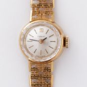Tissot, an 18ct yellow gold vintage Tissot wristwatch with 18ct yellow gold bracelet, 26.79gm.