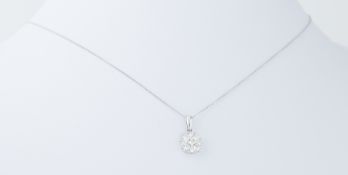 A platinum circular design pendant set with 0.50 carats of round brilliant cut diamonds on a 18"