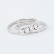 A platinum five stone ring set with approx. 0.50 carats of round brilliant cut diamonds,