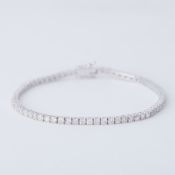 An 18ct white gold line bracelet set with approx. 3.50 carats of round brilliant cut diamonds,