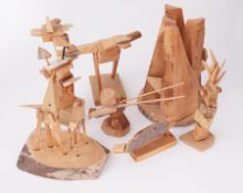 A collection of seven wooden sculptures including 'Father and Son' 2009 and 'Construction' 2005 (