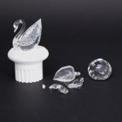 Swarovski Crystal Glass, three pieces comprising Butterfly on Leaf (damaged), Swan and a paper