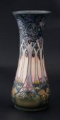 Moorcroft, a tall vase decorated with stylised trees, height 30cm.