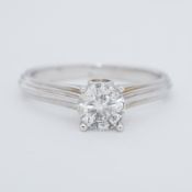 A 14k white gold ring set with a round brilliant cut diamond, approx. 0.94 carats, approx. colour