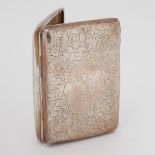 A silver cigar case ornately engraved with flowers & leaves, Birmingham, 1907-08, maker J.G., 4.