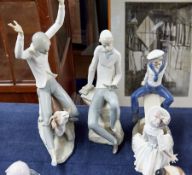 Three Lladro figurines including Boy and Girl on See-Saw (some damages).