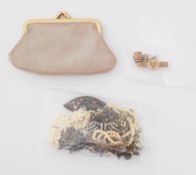 An interesting mixed lot containing a vintage purse, costume jewellery, brooches, ring, earrings and