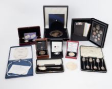 A collection of various commemorative coins to include 2012 GP five pound coin, 2022 Poppy silver