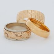 An 18ct yellow gold patterned wide wedding band, 4.80gm, size S 1/2, a 22ct yellow gold wedding